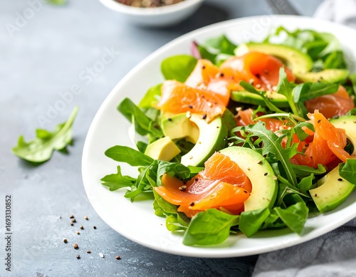 Fresh salmon avocado salad on a plate