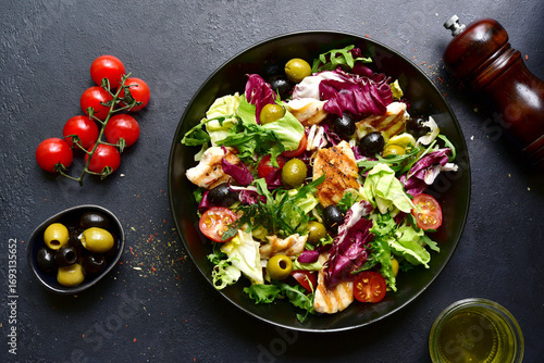 Green salad with grilled chicken fillet. Top view with copy space.