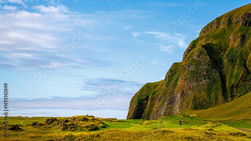 Scenic Heimaey, Iceland with golf course and mountain