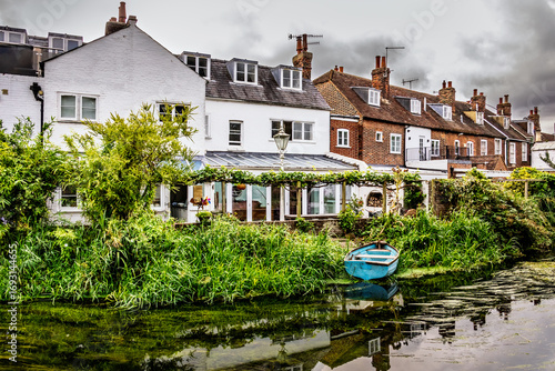 Houses and boat on the river in Canterbury, England