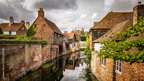 old houses in the old town of Canterbury, England with water