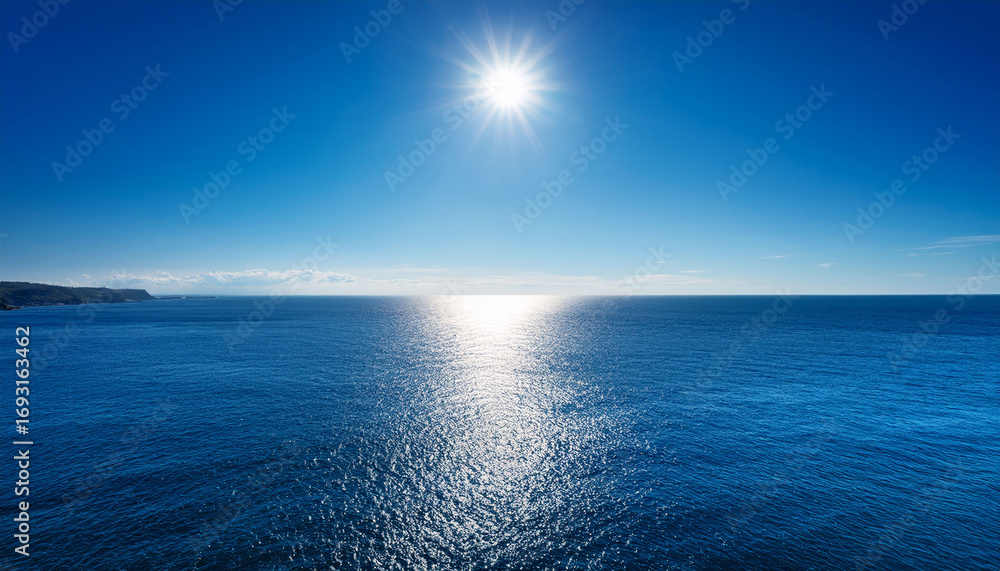 Obraz premium Beautiful A Serene Ocean Scene With A Clear Blue Sky And A Calm Sunlit Sea