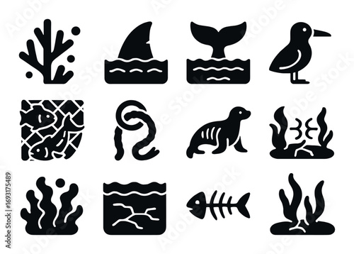 Marine life silhouette icon set. featuring coral, shark fin, whale tail, bird, fish, and seaweed symbols.