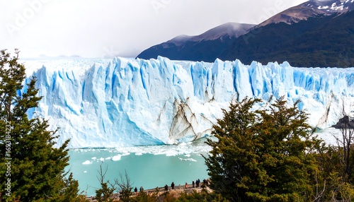 Majestic glacier face, turquoise water, and mountain backdrop
