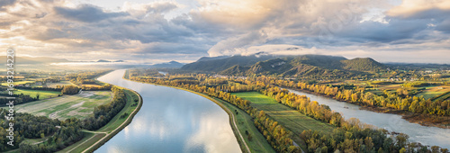 Vászonkép Sunrise Landscape over Rhone River in France with Mountains, Fields and Scenic N