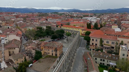 Aerial Drone Flight Along The Iconic Roman Aqueduct Of Segovia In Castile And Leon, Spain, A Historic Landmark.