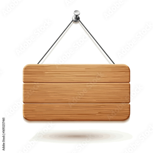 Wooden sign hanging from a nail with a string, casting a shadow.