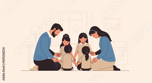 A family of six, including parents and four children, kneeling in a circle and holding hands in prayer at home.