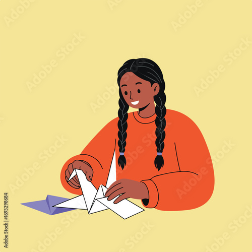 Girl folds origami