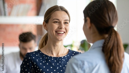 Happy Businesswoman Engaged in Office Conversation