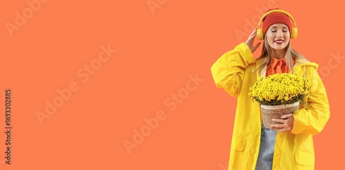 Young woman in raincoat hol...