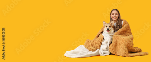 Young woman and Corgi dog w...