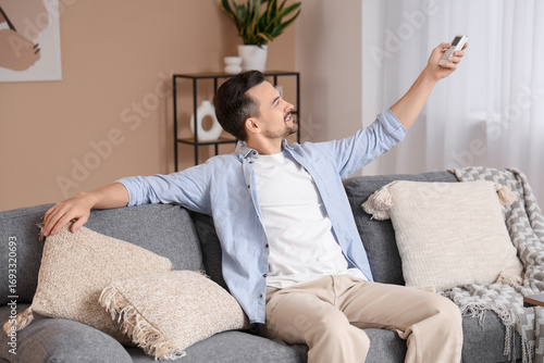 Young man with air conditio...