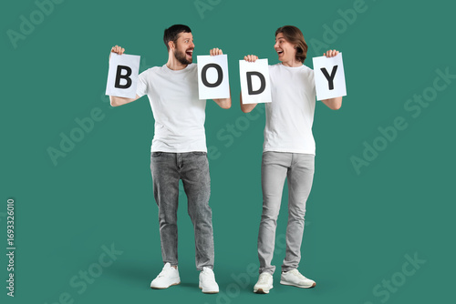 Men with word BODY on green...