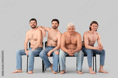 Group of men sitting on cha...