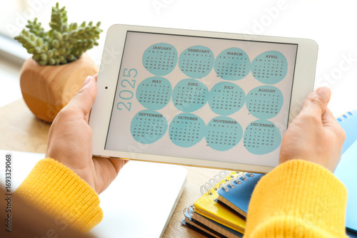 Female hands with calendar ...