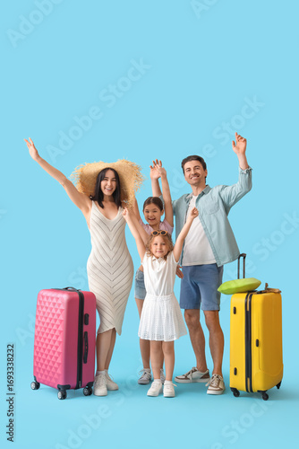 Family of tourists with sui...