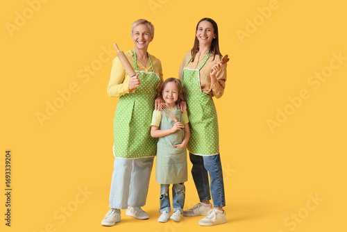 Happy family in aprons with...
