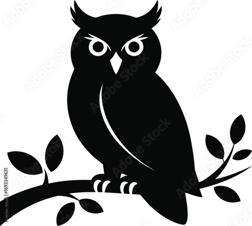 Black owl perched on a branch silhouette bird