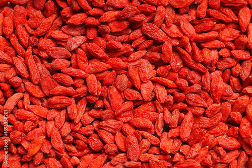 Foto Texture of red dried goji berries as background