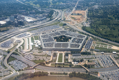 Aerial view of the Pentagon complex with surrounding roads, parking and greenery. g.