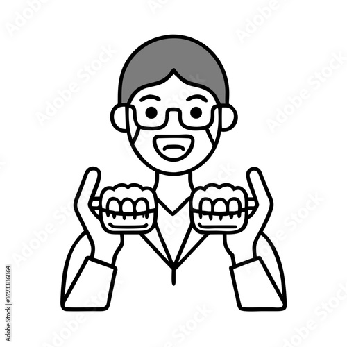 Dentist holding dentures in her hands