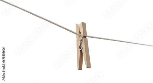 Wooden Clothespin Holding a Rope on Isolated transparent background, Depicting Simplicity and Domesticity