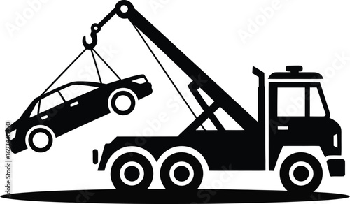 Black and white tow truck lifting car silhouette
