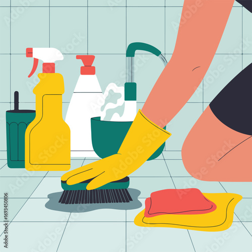 Woman cleaning the bathroom with brush, sponge and cleaning products