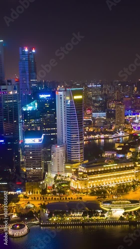 Wallpaper Mural singapore city night illuminated flight over famous marina bay downtown aerial vertical panorama 4k timelapse Torontodigital.ca