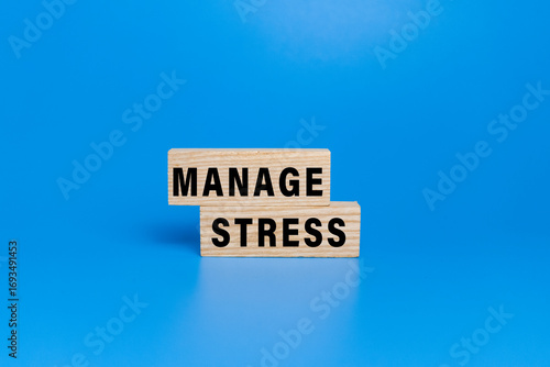 manage stress words text on wooden blocks isolated on blue background