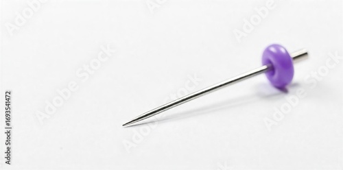 Close-up shot of a single sewing pin, sharp point and head clearly visible, metallic sheen, isolated on white background Ideal for craft, sewing, and DIY projects , texture, dressmaking, point