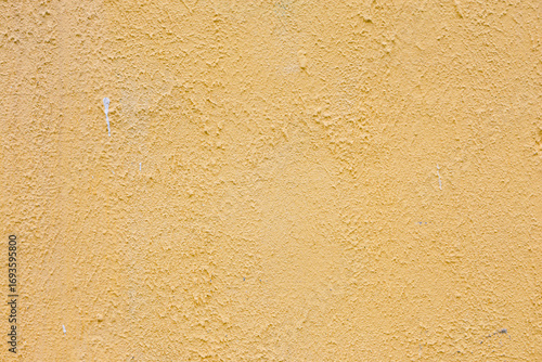 Vintage rough grainy plaster light orange color.