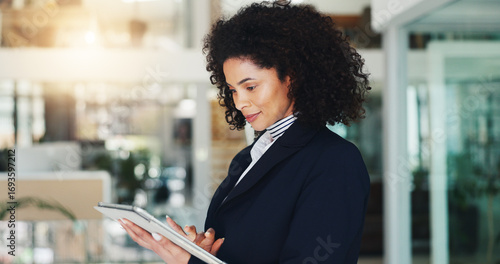 Obraz na plátně Business, woman and reading with tablet in office for research, contact source and confirm schedule