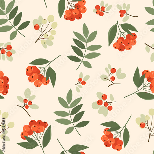 Seamless pattern of autumn rowan berries and green leaves on a cream background