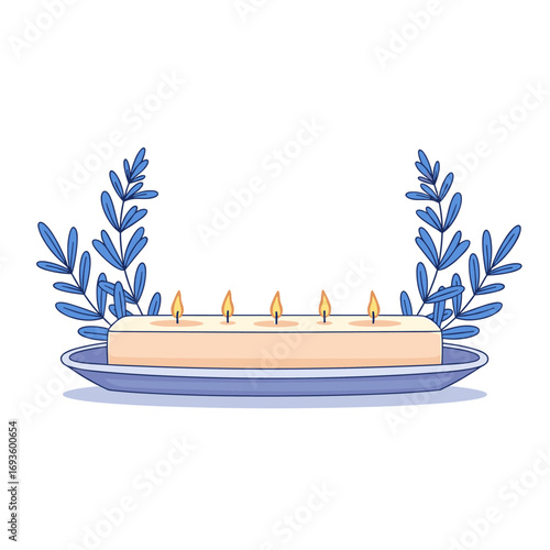 A rectangular shaped candle with five flames burning brightly on a blue saucer with blue foliage on either side