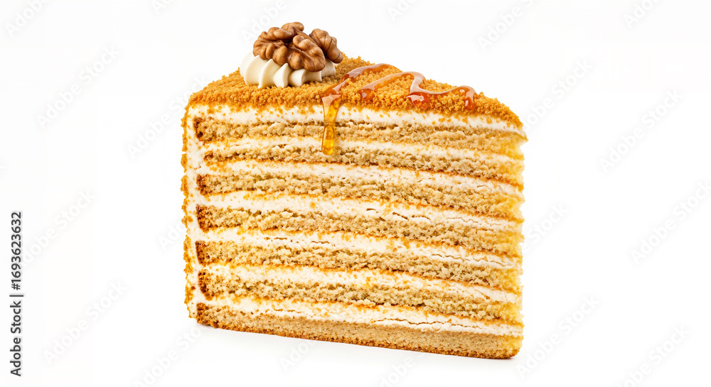 Fototapeta premium A slice of delicious honey cake with layers of cream and nuts on top, isolated on white background