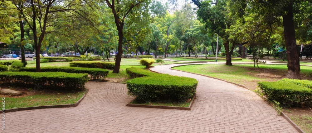 Obraz premium Modern Urban City Park with Brick Pavement and Greenery Premium Outdoor Space for Millennial Resilience and Summer Lifestyle Marketing Campaigns