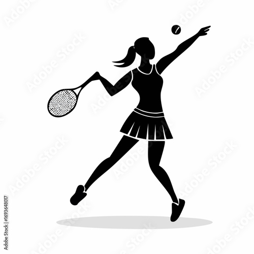Dynamic female tennis player serving a ball with focused intensity on court