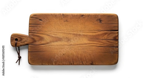 A rustic well-worn wooden cutting board with a handle and a tied leather strap elevated against a plain white background with a subtle shadow