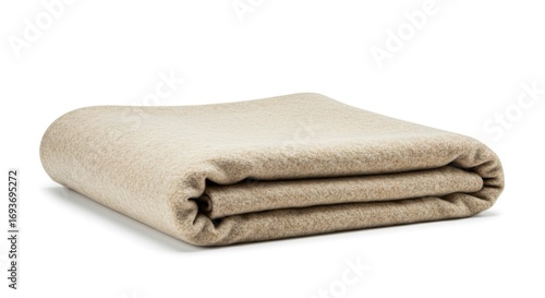 Neatly folded light tan textile a soft blanket or throw displayed on a clean white background