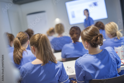 Nurses attend training funded by a foundation grant in a modern elderly care facility Whiteboards and manuals fill the room