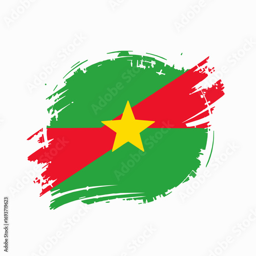 Grunge Flag of Burkina Faso with Yellow Star and Red Stripe on White Background abstract paint splash