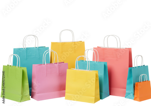 Isolated multicolored paper shopping bags for carrying products, sale or gifts on a surface