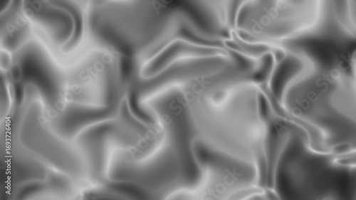 Abstract fluid texture with swirling gray and black patterns resembling liquid motion