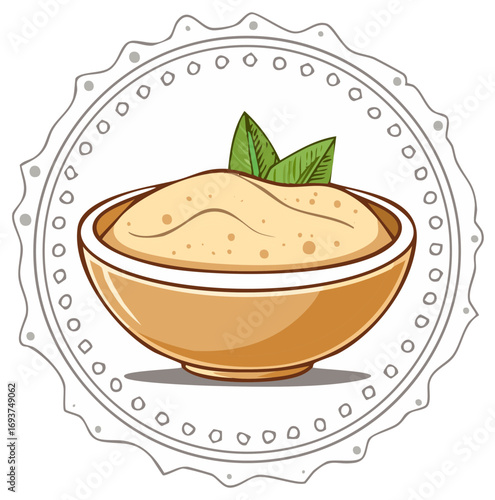 Creamy hummus in a bowl with green leaves garnished inside a decorative circular border