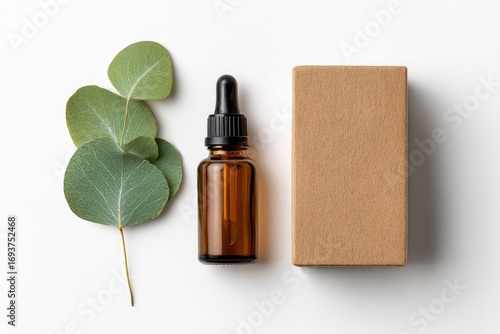 Amber bottle and kraft box with eucalyptus leaves