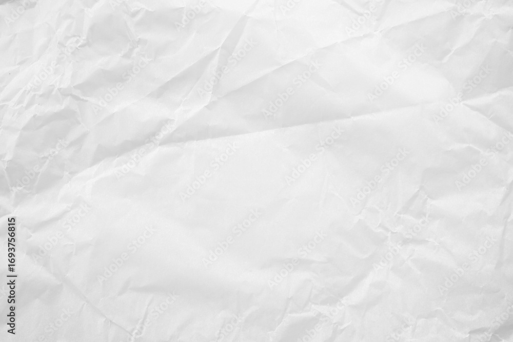 Obraz premium White crumpled paper texture background. Ideal for presentations and branding. Artistic projects that require a realistic recycled paper effect with subtle folds and wrinkles.