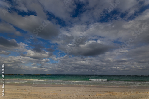 Clouds and white sands of the Caribbean island of Abaco