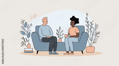 Two individuals are engaged in a friendly conversation while seated on a comfortable couch. The room features various plants, creating a warm atmosphere.